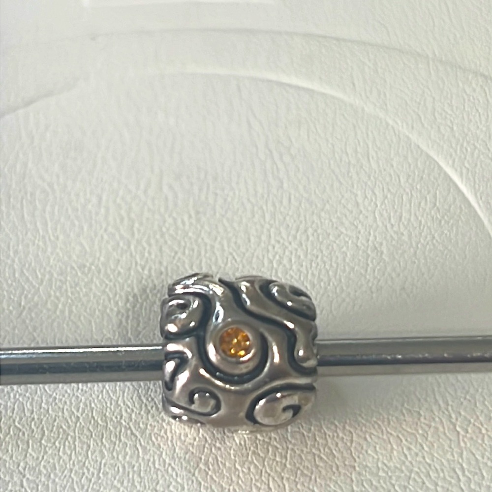 Retired Pandora yellow CZ charm